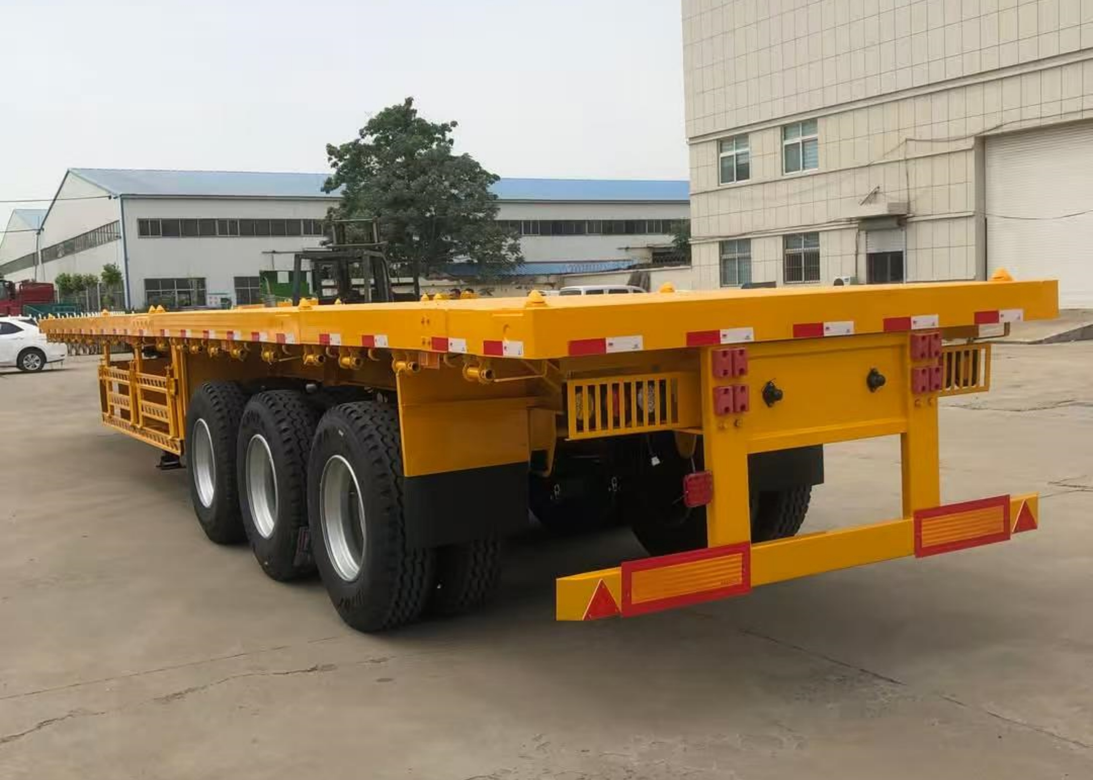 3 Axle 40 Ft Flatbed Semi Trailer For Sale To Tanzania